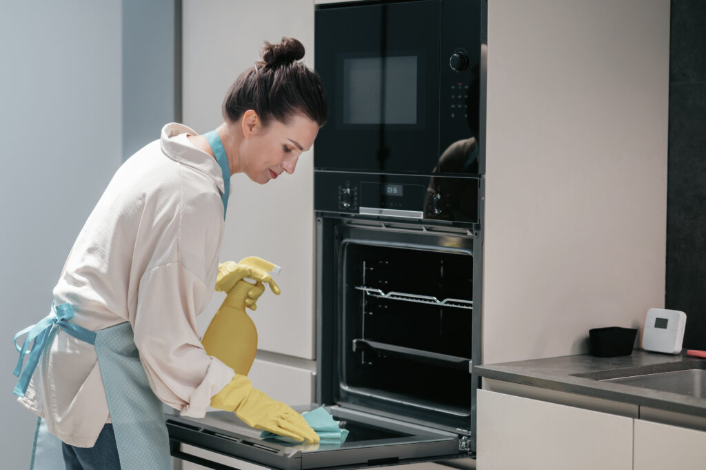 How to Deep Clean Your Kitchen Appliances: Efficient Techniques for Sparkling Results 7 cleaning kitchen housewife yellow gloves cleaning kitchen