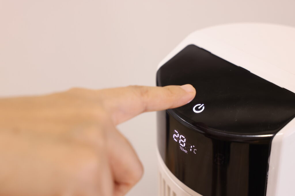 How to Descale Keurig: Quick and Easy Maintenance Tips 9 closeup asian woman hand pressing button air purifier machine bedroom protect pm 25