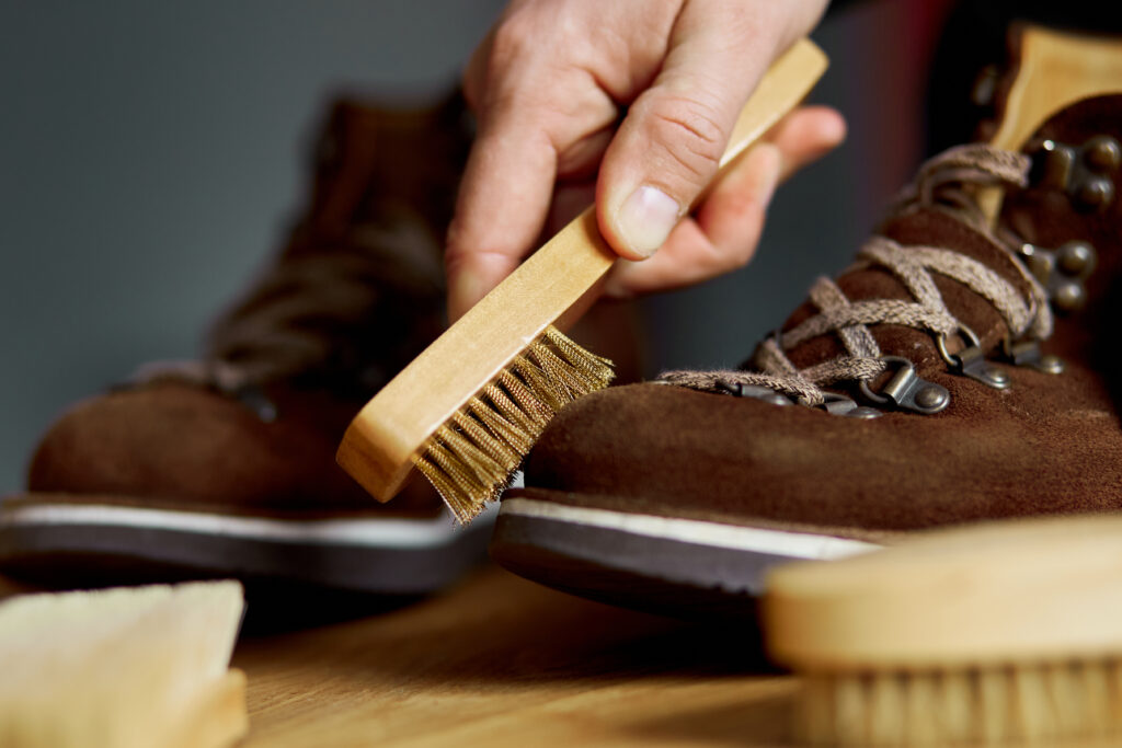 How to Clean Suede Shoes: A Simple Guide for Prolonging Their Life 8 man s hand cleans suede shoes with brush 2